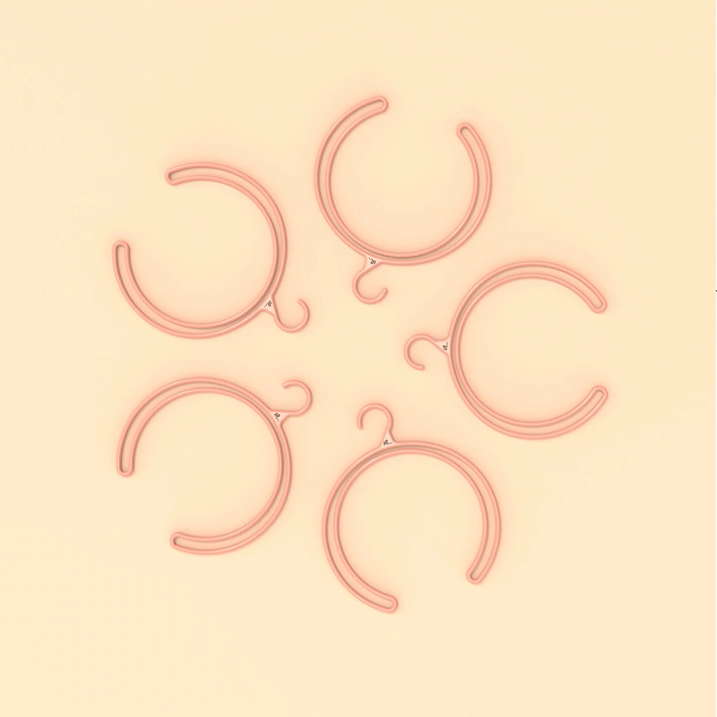 Cintre à perruque rose Head Up simple et élégant pour un rangement compact en série